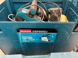 a blue box with tools in it sitting on a table