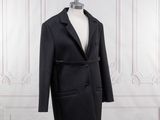 an image of a black coat on a mannequin stand
