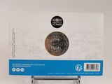 a picture of a coin in a box on a table