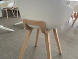 a white chair sitting in the middle of a room