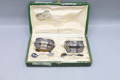 a green case with silverware in it on a table