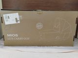 a box that is sitting on a bed in a room