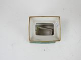 a small square bowl with a small square bowl inside of it