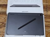 an open box with a pen sitting on top of it on a table