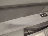 the interior of a car with the door open and a paper towel hanging out of the door