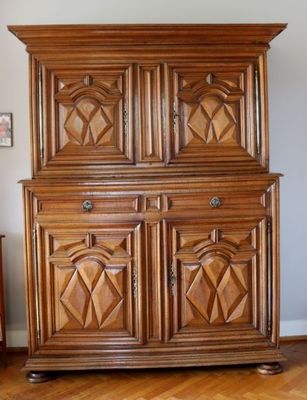an image of a wooden cabinet in the corner of a room