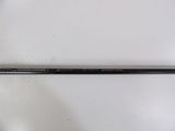 a close up of a golf club on a white surface