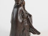 statue of a woman sitting on a rock with a child