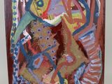 peinture abstraite représentant une femme et un chat sur un chevalet en bois