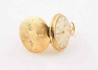 an image of a close up of a pocket watch on a white surface