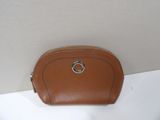brown leather purse with a silver ring on top of it