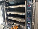 an image of a commercial oven with a tray of donuts in it