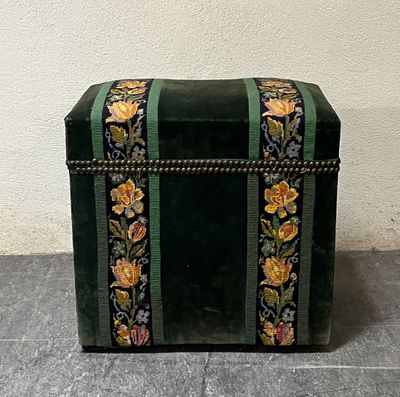 a small green box with a floral design on it