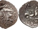 a silver coin with an image of a bull on it