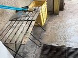 a wooden bench sitting on the side of a building