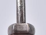 a close up of a metal object on a white surface
