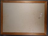 a picture of a mirror hanging on the wall