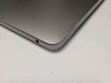 a close up of a laptop on a white table