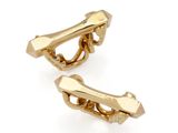 two pairs of gold plated cufflinks on a white background