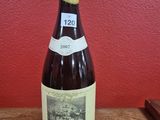 a bottle of wine that is sitting on a table