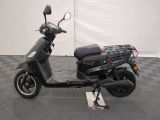 an image of a scooter parked on a checkered floor