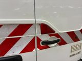a white van with red and white stripes on the side