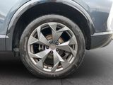 a close up of a car ' s wheel on the street