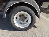a close up of a flat tire on a truck