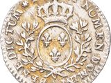 an old silver coin with a crown on top of it