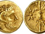a gold coin with an image of a woman on it