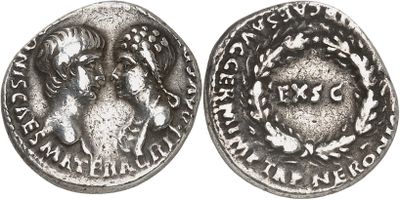 a close up of a silver coin with a woman on it