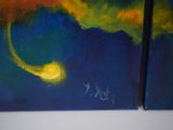 two paintings on the wall of a room one is yellow and the other is blue