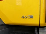 a close up of a yellow truck with the number 46 on it