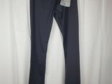 a pair of dark blue pants hanging on a white curtain