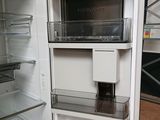 an open refrigerator with its door open in a room