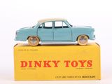 a blue toy car sitting on top of a yellow box