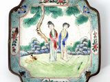 a plate with a picture of two people on it