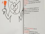 a book with a drawing of a cat holding a light bulb