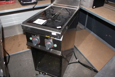 an image of a gas stove in the corner of a room