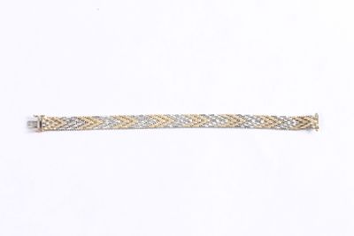a silver and gold bracelet on a white background