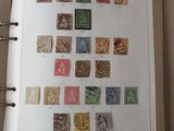 an open book with a bunch of stamps on it