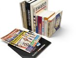 several books are stacked on top of each other on a white surface