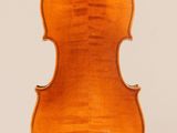 an old violin with a wooden back and a wooden bow