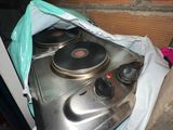 a metal stove top with two burners on top of it