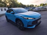 a blue toyota harrier parked in a parking lot