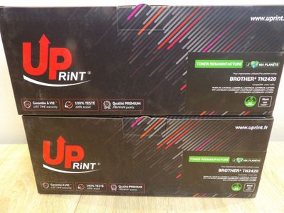two boxes of upprintt printer paper on a wooden table