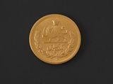 an image of a gold coin with a picture of a man riding a horse