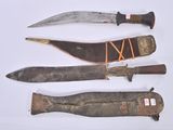 several different types of knives are displayed on a white surface