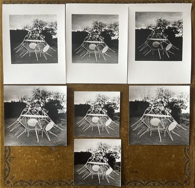 four black and white photographs of a table and chairs on a cork board