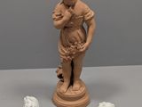 three figurines that are sitting on a table